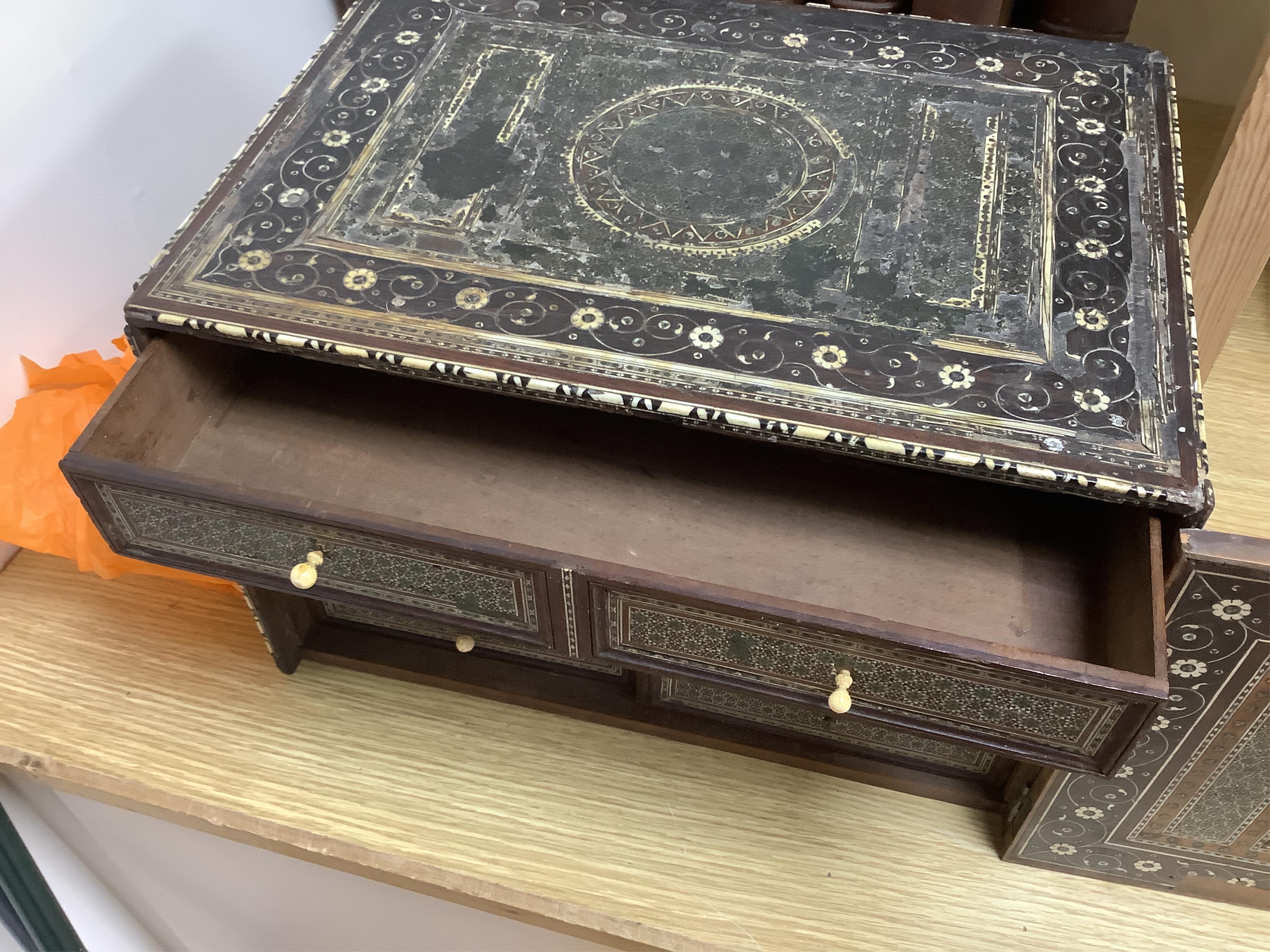 An early 17th century Indo-Portuguese ivory inlaid table cabinet, Gujarat, 29cm high. Condition - poor, losses CITES Submission reference 3XBFQXPT